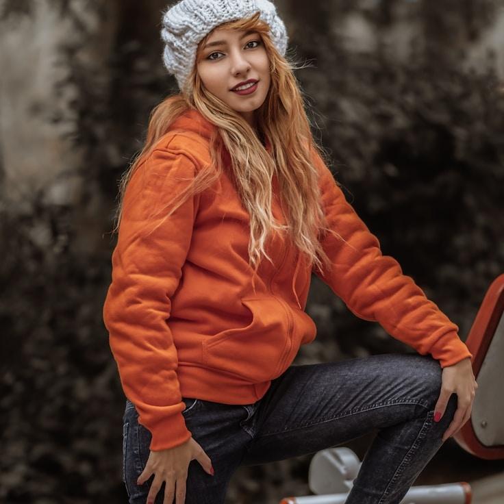 Kaveri Mehta, Lead Design Curator at GroveBenchWorks, reviewing corporate floral arrangements